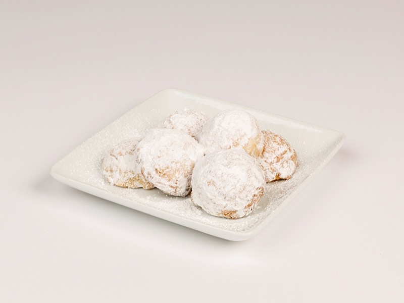 Mexican wedding cookies coated in powdered sugar