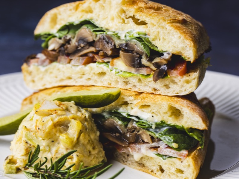 A mushroom sandwich on a toasted roll