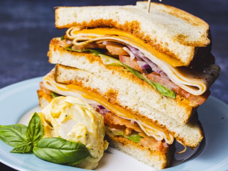 A turkey sandwich cut and stacked